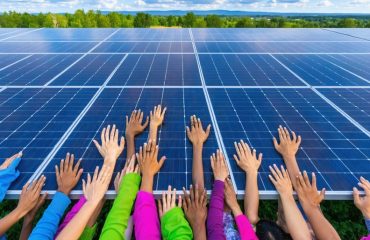 Conceptual illustration showcasing community solar panels empowering diverse households, represented by interconnected hands reaching out from the solar array against a vibrant neighborhood backdrop.